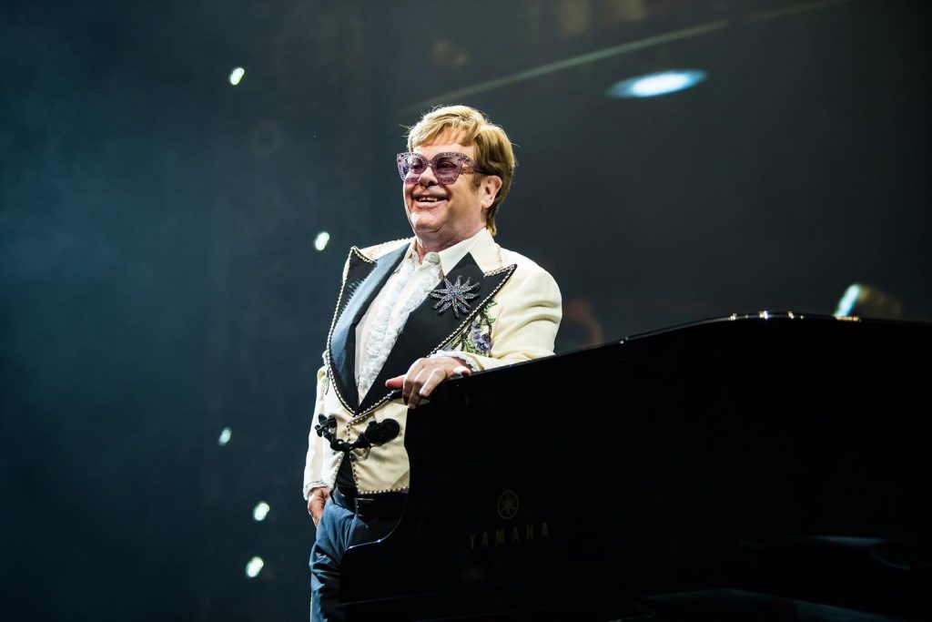 Elton John Net Worth: Age, Family, Height & More